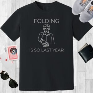 Black colored unisex crewneck poker-themed T-shirt. Design features the text 'Folding is so last year'. Image is a minimalist line image of a man with stacks of poker chips.