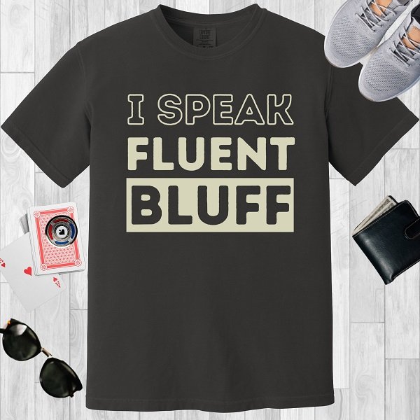Graphite colored unisex crewneck poker-themed T-shirt. Design features the text 'I speak fluent bluff'.