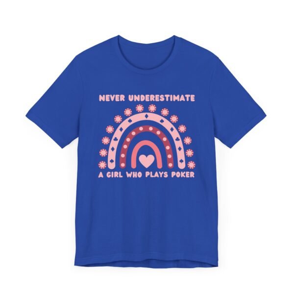 A royal blue colored Bella+Canvas 3001 T-shirt featuring a boho rainbow graphic in shades of pink. The graphic incorporates elements of the game of poker, such as card suits and poker chips. The text in the design says "Never underestimate a girl who plays poker".
