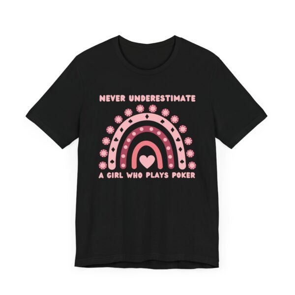 A black colored Bella+Canvas 3001 T-shirt featuring a boho rainbow graphic in shades of pink. The graphic incorporates elements of the game of poker, such as card suits and poker chips. The text in the design says "Never underestimate a girl who plays poker".