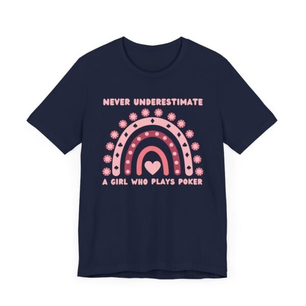 A navy colored Bella+Canvas 3001 T-shirt featuring a boho rainbow graphic in shades of pink. The graphic incorporates elements of the game of poker, such as card suits and poker chips. The text in the design says "Never underestimate a girl who plays poker".