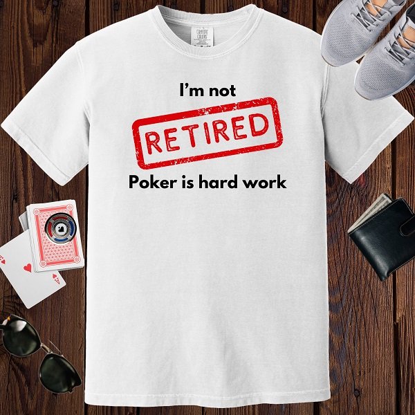 White colored unisex crewneck poker-themed T-shirt. Design features the text 'I'm not retired, poker is hard work'.