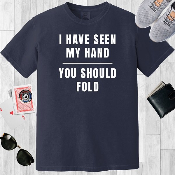 Navy colored unisex crewneck poker-themed T-shirt. Design features the text 'I have seen my hand. You should fold'.