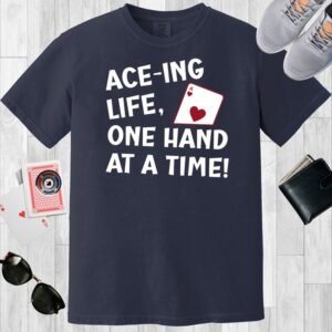 Navy colored unisex crewneck poker-themed T-shirt. Design features the text 'Ace-ing life. One hand at a time!' An image of the Ace of hearts.
