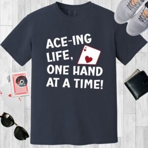 Midnight colored Comfort Colors crewneck T-shirt. Design features an Ace of hearts and the text "Ace-ing life, one hand at a time".