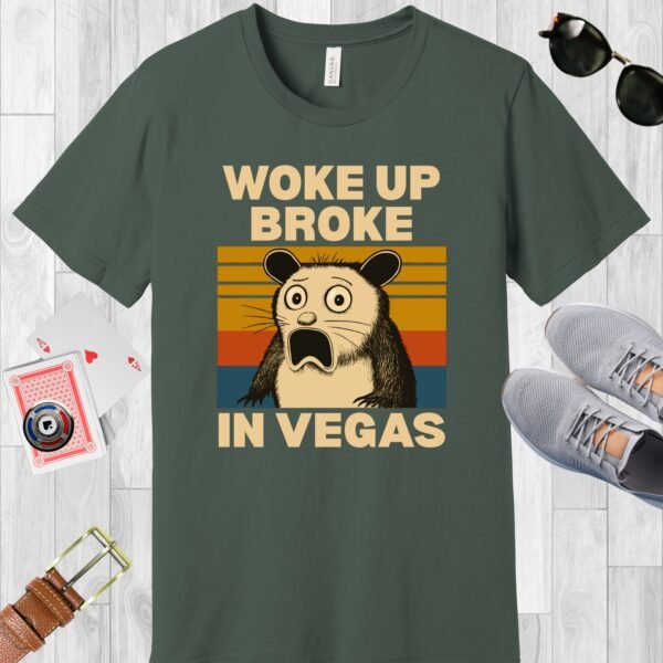Military Green colored Bella+Canvas crewneck poker-themed T-shirt. Design features a shocked possum and the text 'Woke up broke in Vegas'.