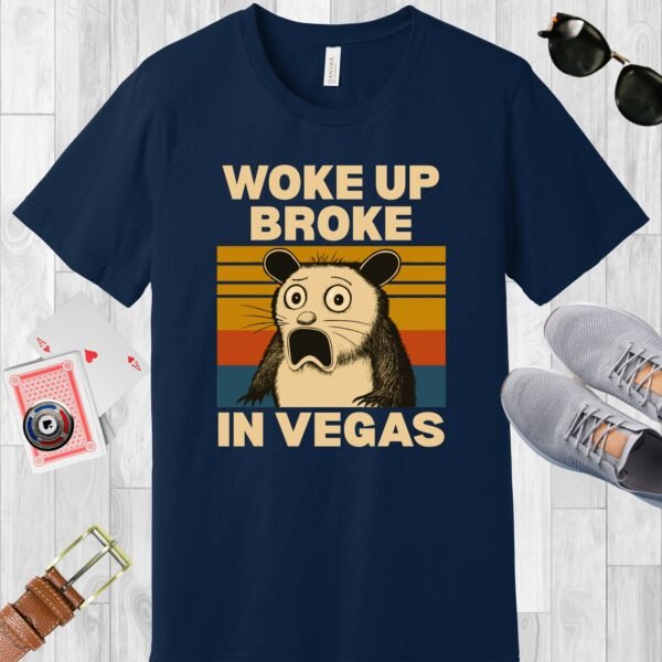Navy colored Bella+Canvas crewneck poker-themed T-shirt. Design features a shocked possum and the text 'Woke up broke in Vegas'.