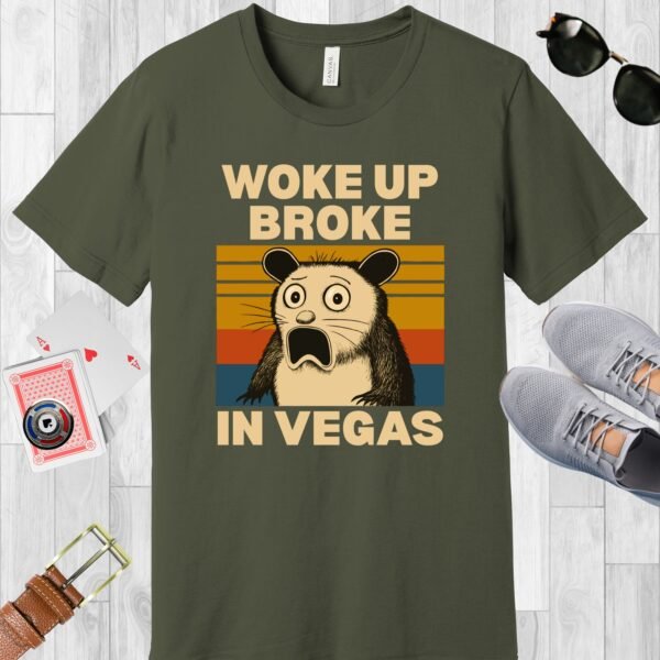 Army colored Bella+Canvas crewneck poker-themed T-shirt. Design features a shocked possum and the text 'Woke up broke in Vegas'.