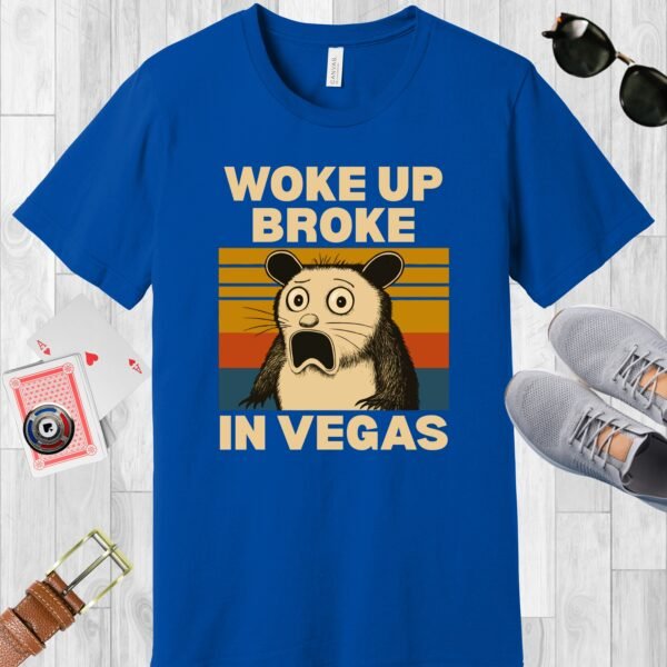 True Royal blue colored Bella+Canvas crewneck poker-themed T-shirt. Design features a shocked possum and the text 'Woke up broke in Vegas'.