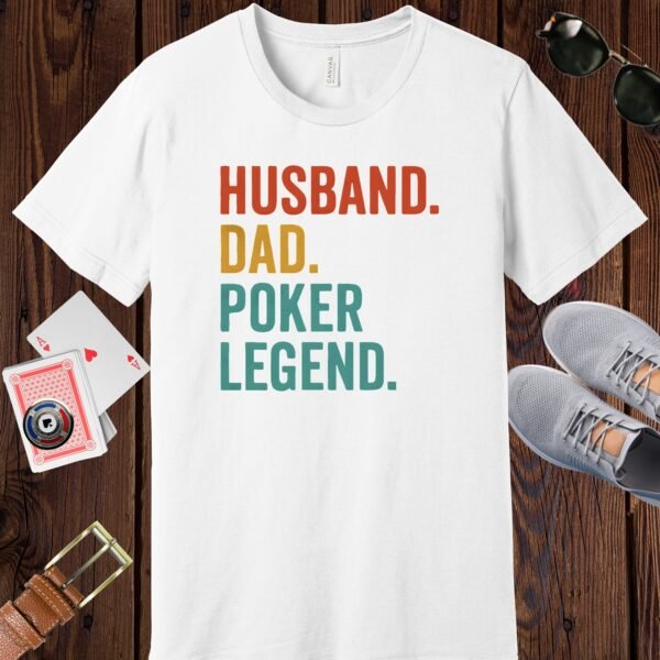 White colored Bella+Canvas crewneck poker-themed T-shirt. Design features the multi-colored text 'Husband. Dad. Poker Legend.'