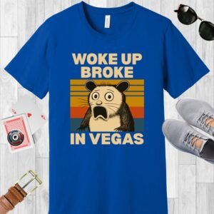 True Royal blue colored Bella+Canvas crewneck poker-themed T-shirt. Design features a shocked possum and the text 'Woke up broke in Vegas'.