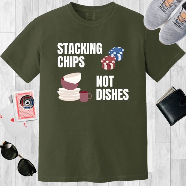 Moss colored Comfort Colors crewneck poker-themed T-shirt. Design features the text 'Stacking chips not dishes' along with images of poker chip stacks and piled dishes.