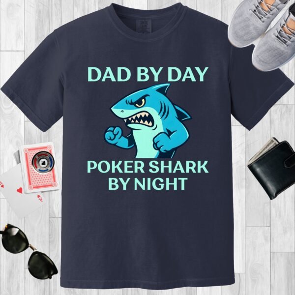 Navy colored Comfort Colors crewneck poker-themed T-shirt. Design features the text 'Dad by day Poker Shark by night' along with an image of an intimidating shark.