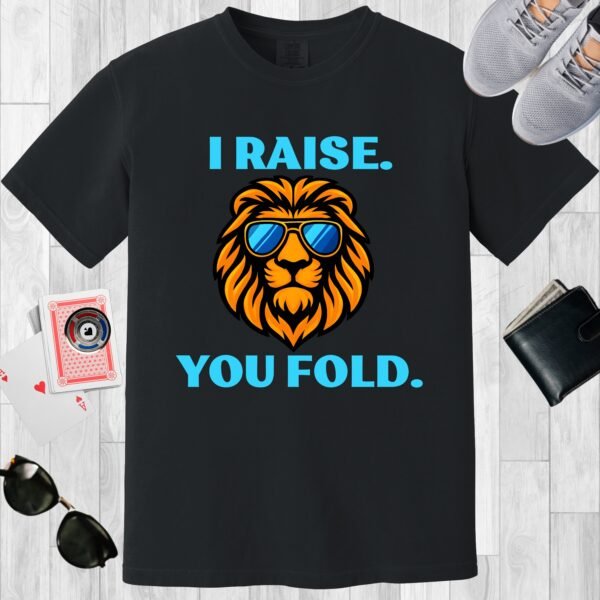 Black colored Comfort Colors crewneck poker-themed T-shirt. Design features the text 'I raise. You fold.' along with an image of a lion wearing sunglasses.