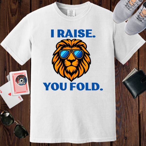 White colored Comfort Colors crewneck poker-themed T-shirt. Design features the text 'I raise. You fold.' along with an image of a lion wearing sunglasses.