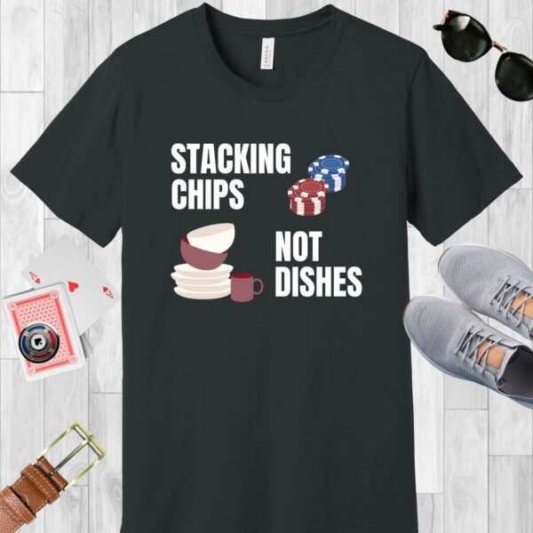 Dark Grey colored Bella+Canvas crewneck poker-themed T-shirt. Design features the text 'Stacking chips not dishes' along with images of poker chip stacks and piled dishes.