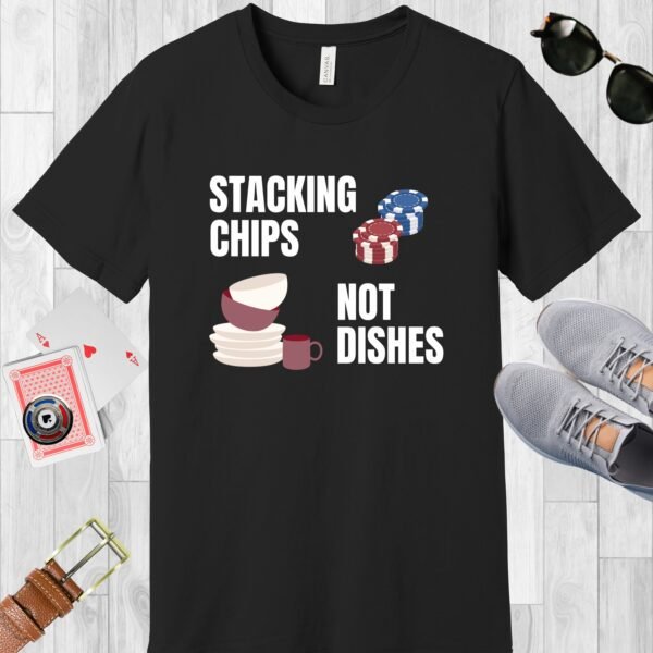 Black colored Bella+Canvas crewneck poker-themed T-shirt. Design features the text 'Stacking chips not dishes' along with images of poker chip stacks and piled dishes.