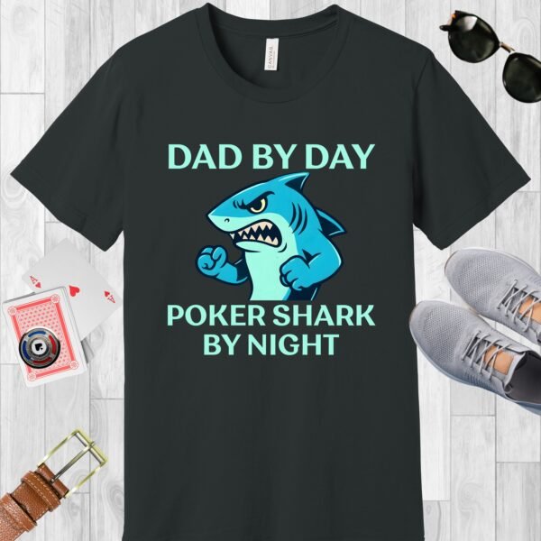 Dark Grey colored Bella+Canvas crewneck poker-themed T-shirt. Design features the text 'Dad by day Poker Shark by night' along with an image of an intimidating shark.