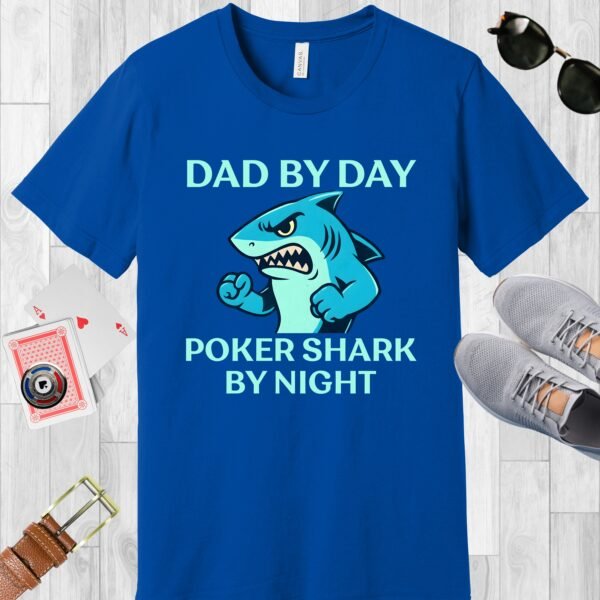 True Royal (blue) colored Bella+Canvas crewneck poker-themed T-shirt. Design features the text 'Dad by day Poker Shark by night' along with an image of an intimidating shark.