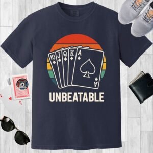 Navy colored Comfort Colors crewneck poker-themed T-shirt. Design features a vintage sunset overlaid with a royal flush, and the text 'Unbeatable'.