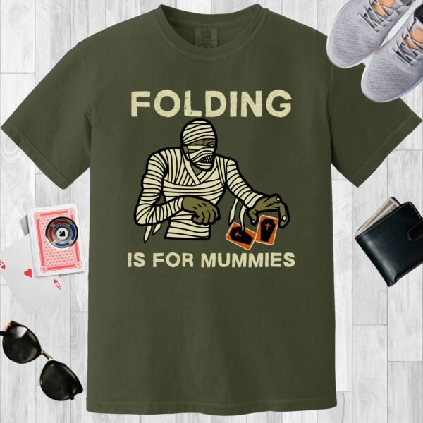 Moss colored unisex crewneck poker-themed T-shirt. Design features the text 'Folding is for mummies'. A mummy folding a pair of cards.
