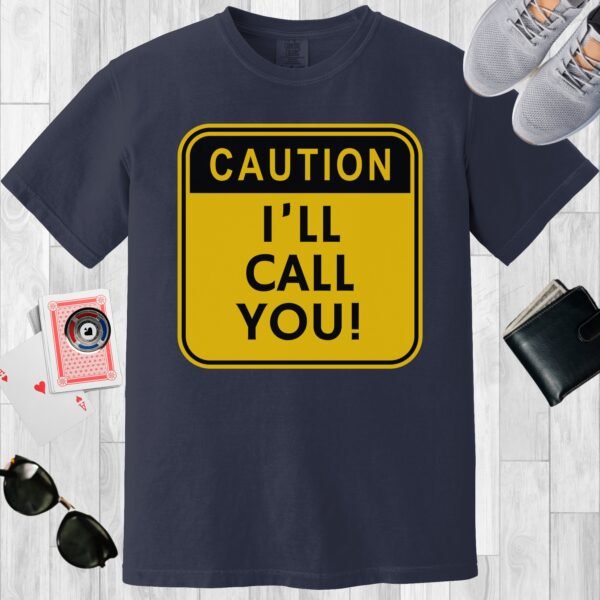 Navy colored unisex crewneck poker-themed T-shirt. Design features the text 'Caution I'll call you' on a square yellow background.