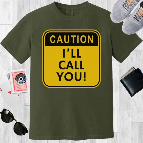 Moss colored unisex crewneck poker-themed T-shirt. Design features the text 'Caution I'll call you' on a square yellow background.