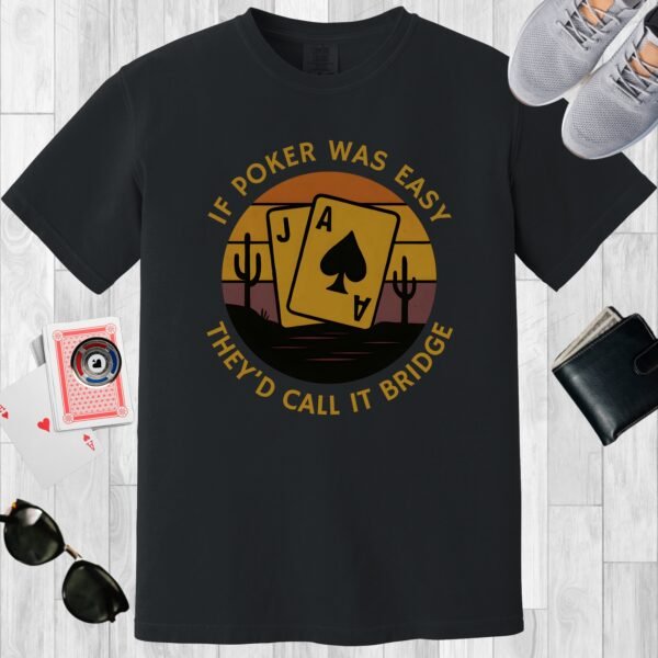 Black colored unisex crewneck poker-themed T-shirt. Design features the text 'If poker was easy they'd call it bridge'. Image of an Ace and a Jack playing card, on a vintage sunset background.
