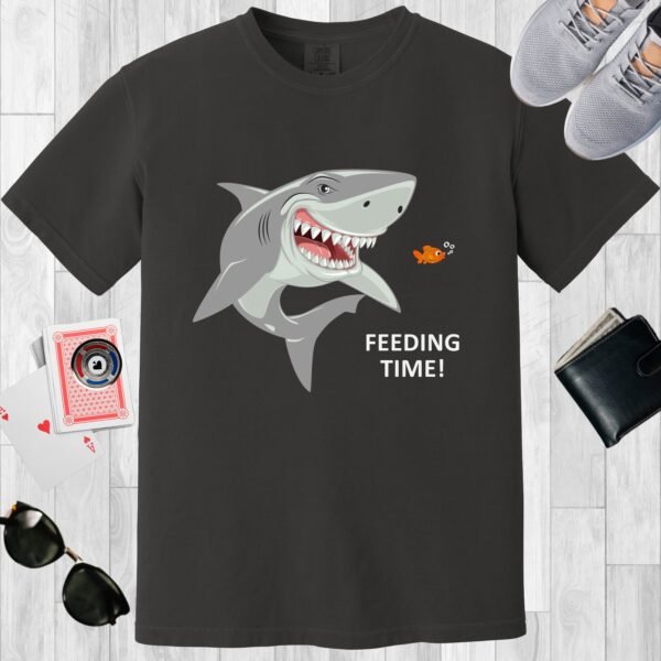 Graphite colored unisex crewneck poker-themed T-shirt. Design features the text 'Feeding time'. Image of a shark and small fish.