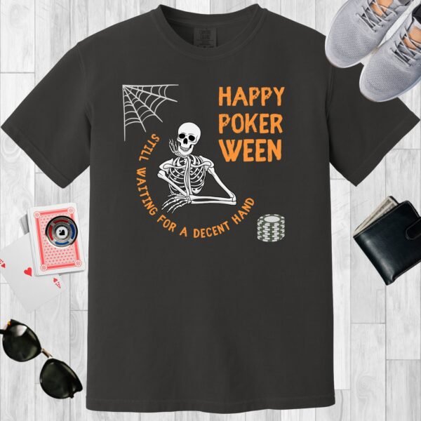 Graphite colored unisex crewneck poker-themed T-shirt. Design features the text 'Happy Pokerween'. There's a skeleton, a cobweb, and a stack of poker chips.