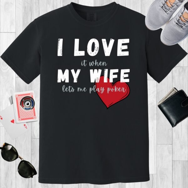 Black colored unisex crewneck poker-themed T-shirt. Design features the text 'I love it when my wife lets me play poker'.