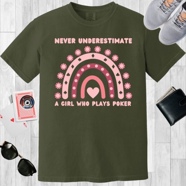 Moss colored unisex crewneck poker-themed T-shirt. Design features the text Never underestimate a girl who plays poker'. Includes an image of a boho rainbow incorporating poker chips.