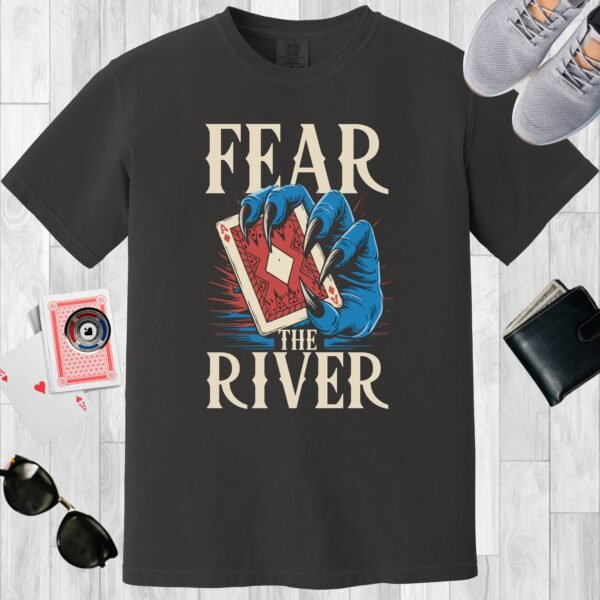 Graphite colored unisex crewneck poker-themed T-shirt. Design features the text 'Fear the river'. Image of a blue monster claw/hand holding an Ace playing card.