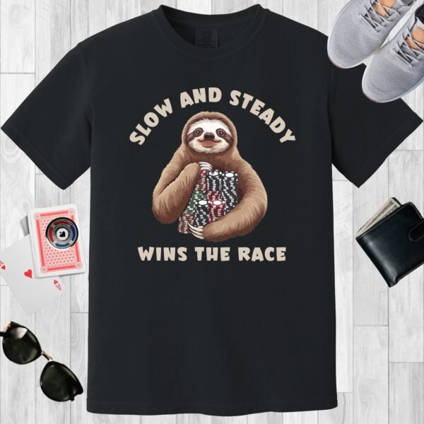 Black colored unisex crewneck poker-themed T-shirt. Design features the text 'Slow and steady wins the race'. Image of a sloth with stacks of poker chips.