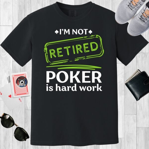 Black colored unisex crewneck poker-themed T-shirt. Design features the text 'I'm not retired. Poker is hard work'.