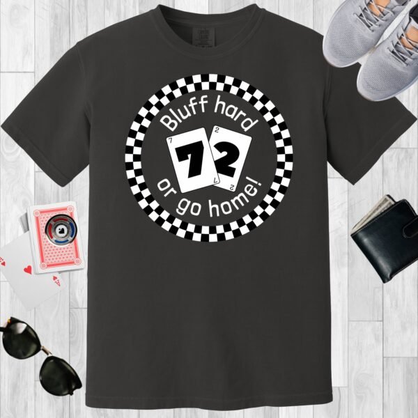 Graphite colored unisex crewneck poker-themed T-shirt. Design features the text 'Bluff hard or go home!'. Image of a circular checkerboard design and playing cards 7 and 2.