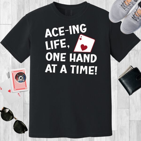 Black colored unisex crewneck poker-themed T-shirt. Design features the text 'Ace-ing life. One hand at a time!' An image of the Ace of hearts.
