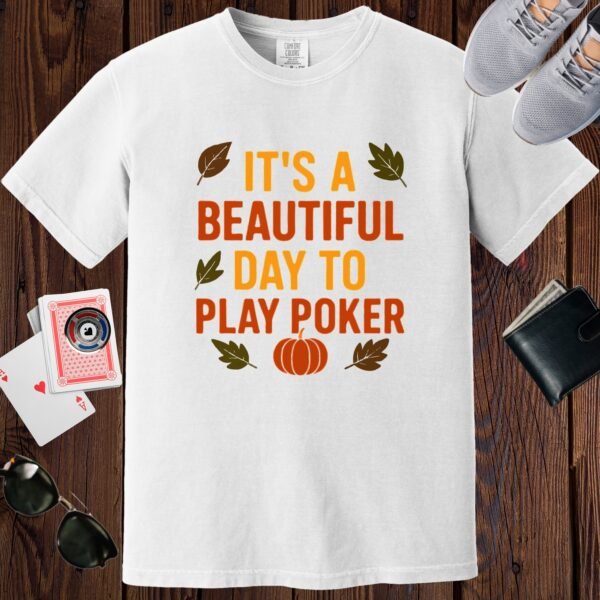 White colored unisex crewneck poker-themed T-shirt. Design features the text 'It's a beautiful day to play poker', in fall (autumn) colors.