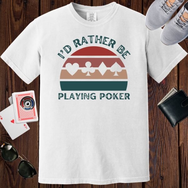 White colored unisex crewneck poker-themed T-shirt. Design features the text 'I'd rather be playing poker'. Card suits on a retro sunset background.