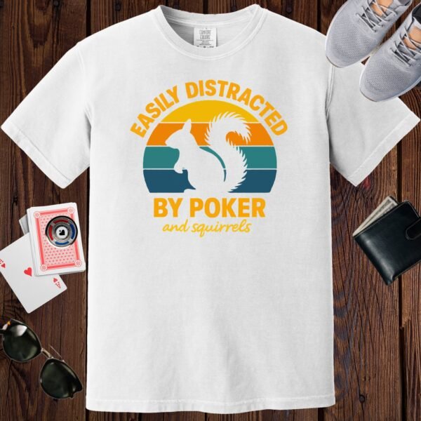 White colored unisex crewneck poker-themed T-shirt. Design features the text 'Easily distracted by poker and squirrels'. A squirrel on a retro sunset background.