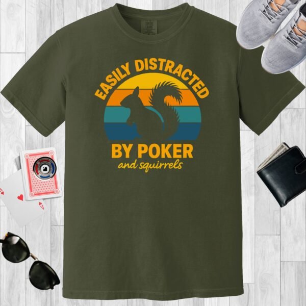 Moss colored unisex crewneck poker-themed T-shirt. Design features the text 'Easily distracted by poker and squirrels'. A squirrel on a retro sunset background.