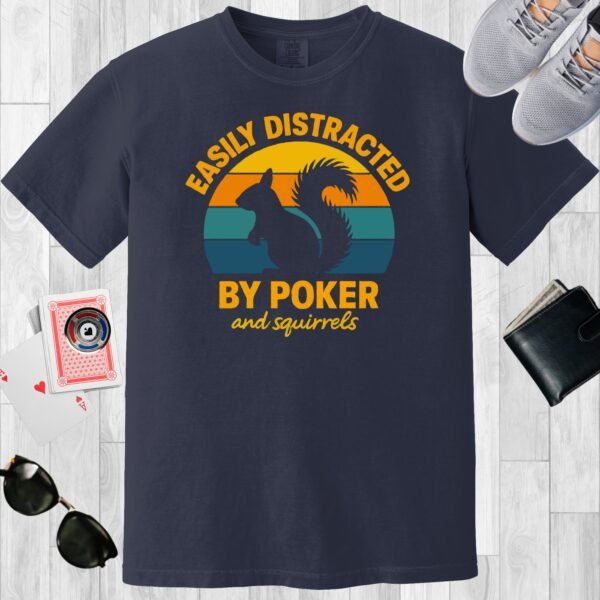 Navy colored unisex crewneck poker-themed T-shirt. Design features the text 'Easily distracted by poker and squirrels'. A squirrel on a retro sunset background.
