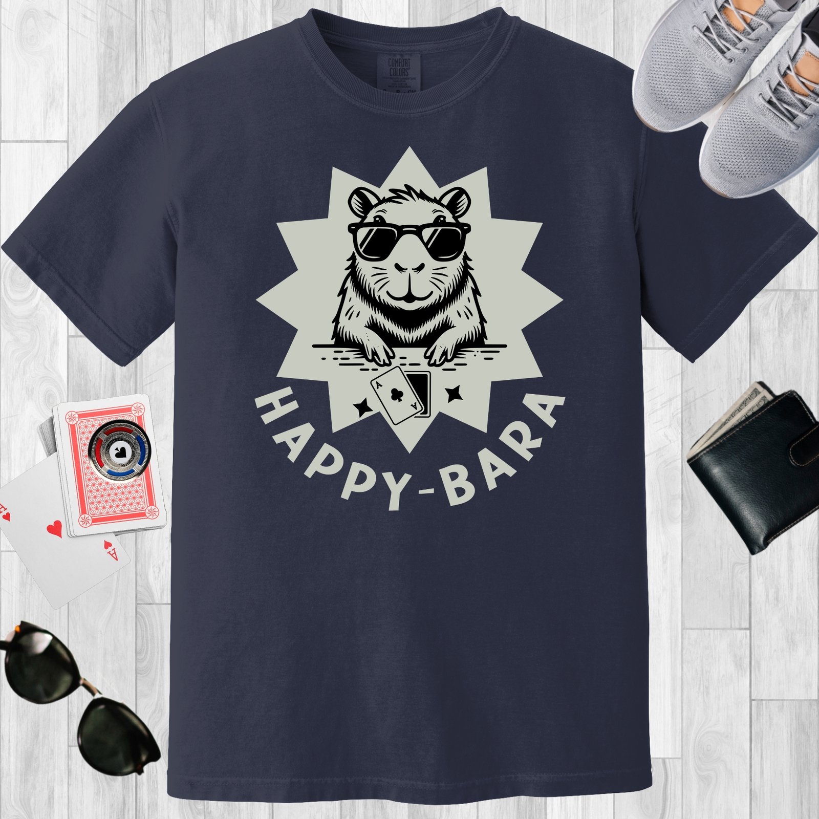 Navy colored unisex crewneck poker-themed T-shirt. Design features the text 'Happy-bara'. An image of a sunglass-wearing capybara with playing cards on a starburst background.