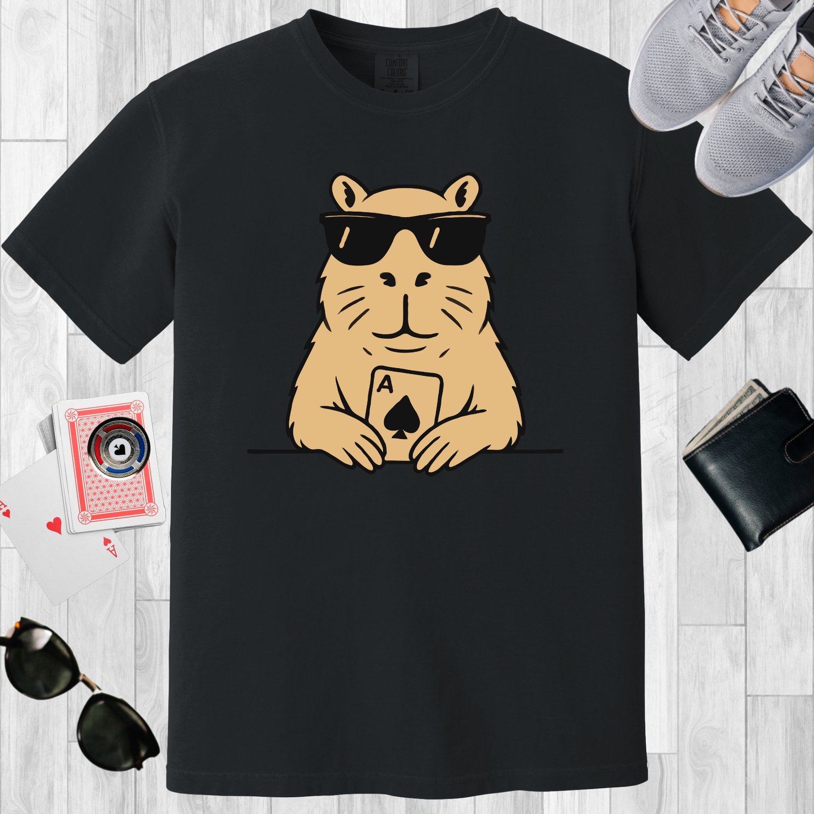 Black colored unisex crewneck poker-themed T-shirt. Design features an image of a capybara with an Ace playing card.