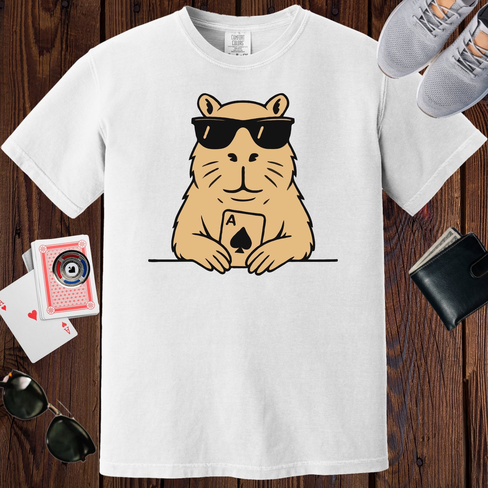 White colored unisex crewneck poker-themed T-shirt. Design features an image of a capybara with an Ace playing card.