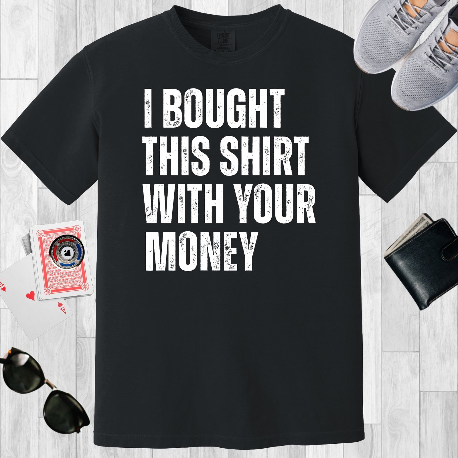 Black colored unisex crewneck poker-themed T-shirt. Design features the text 'I bought this shirt with your money'.