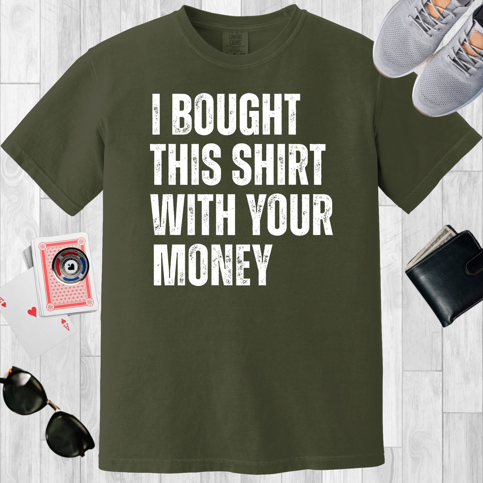 Moss colored unisex crewneck poker-themed T-shirt. Design features the text 'I bought this shirt with your money'.