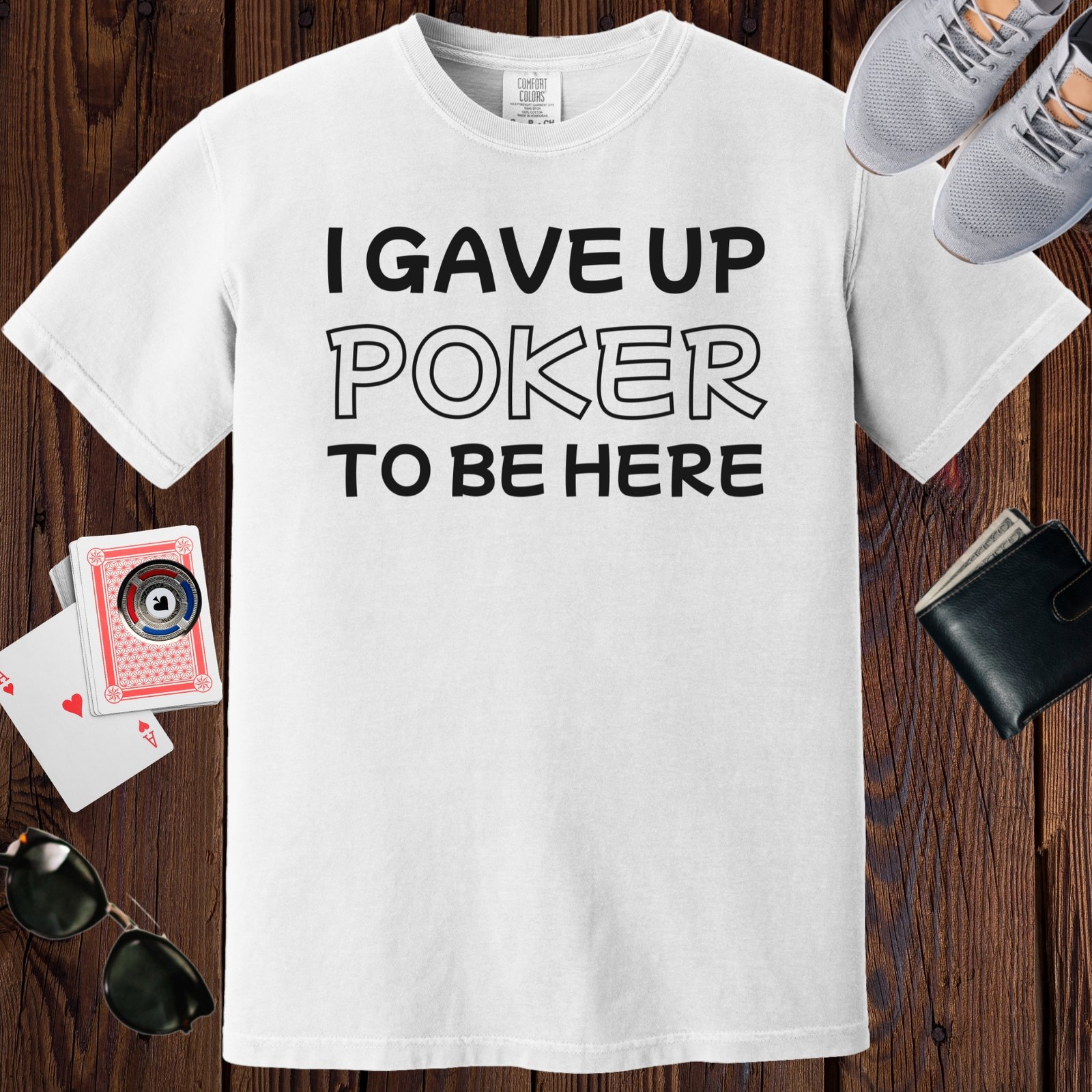 White colored unisex crewneck poker-themed T-shirt. Design features the text 'I gave up poker to be here'.