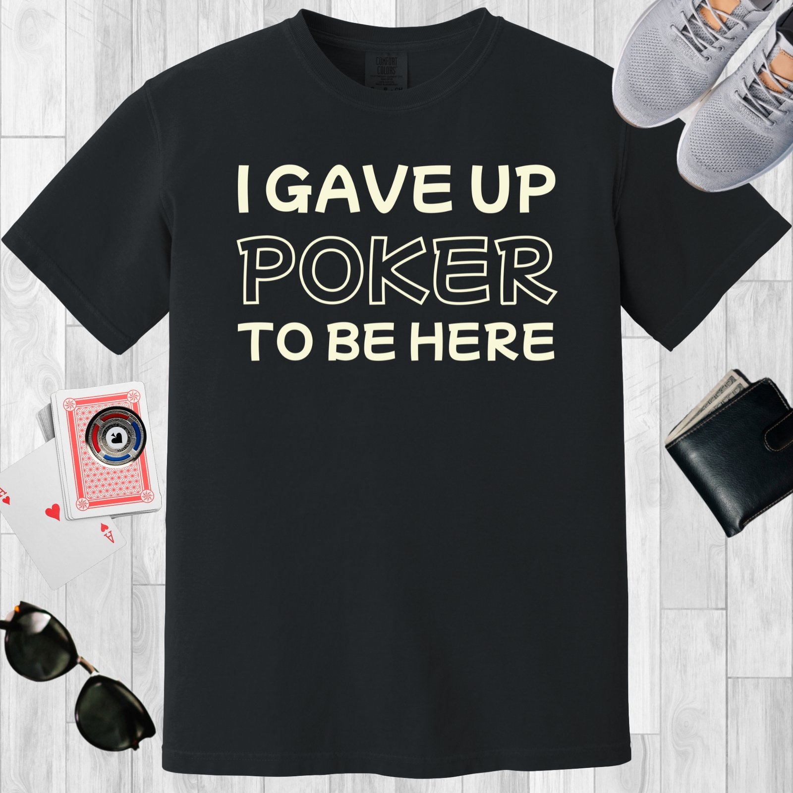 Black colored unisex crewneck poker-themed T-shirt. Design features the text 'I gave up poker to be here'.