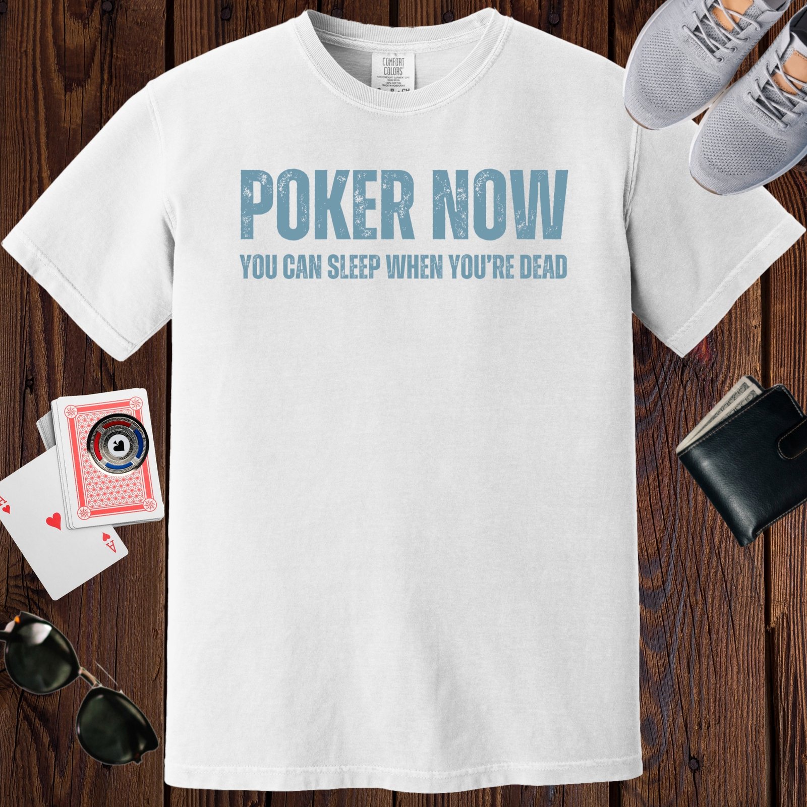 White colored unisex crewneck poker-themed T-shirt. Design features the text 'Poker now, you can sleep when you're dead'.